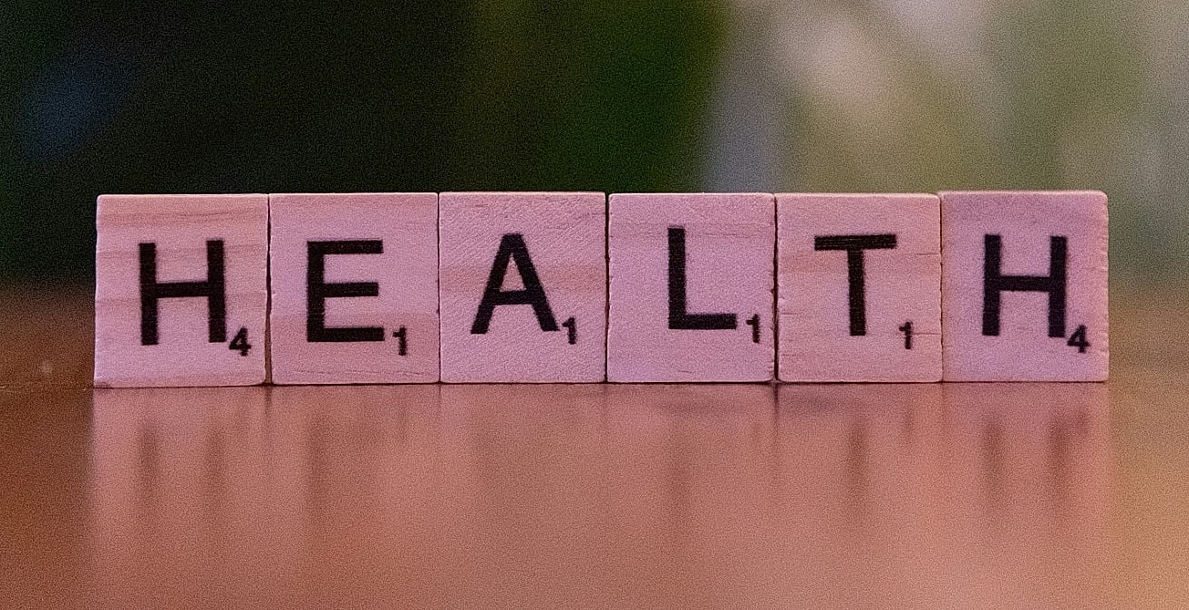 Woman jogging at sunset in a park.