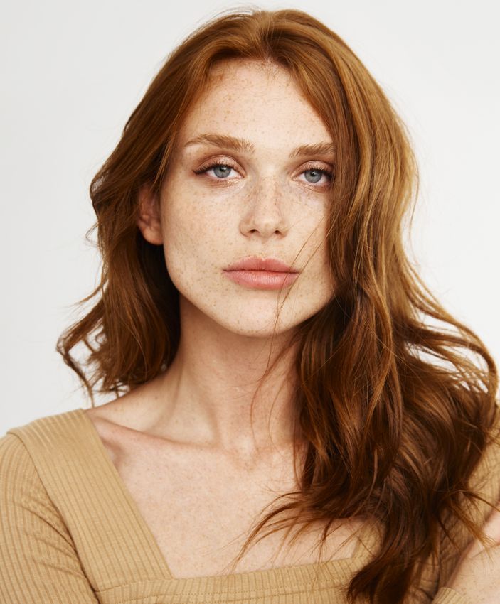 botox ardmore feature - woman with long red hair wearing a cream colored top